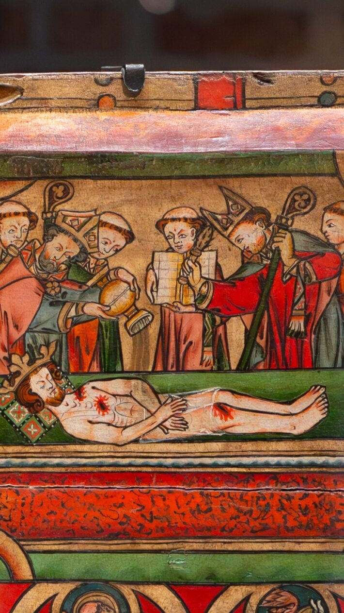 Bilde fra Olavsfrontalet. Olav den hellige er død, omkranset av pilegrimer og geistlige.